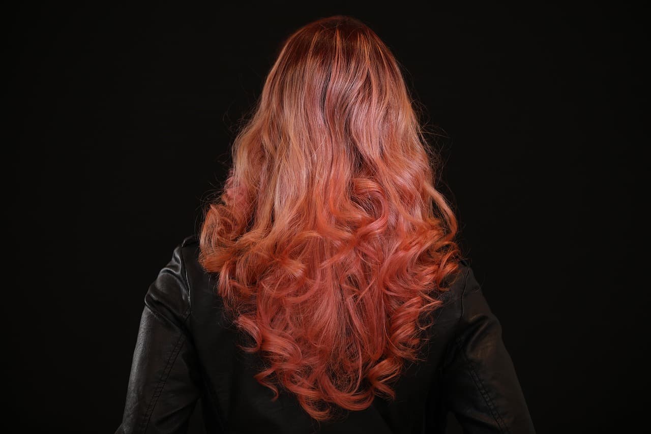 Long layered red hair, seen from behind
