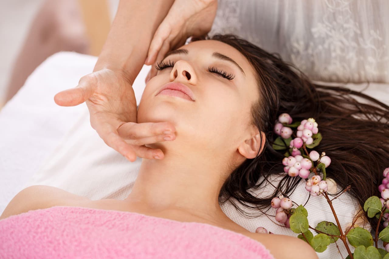 A client relaxing during a face treatment