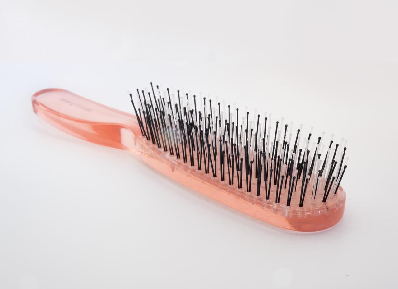 A pink hairbrush