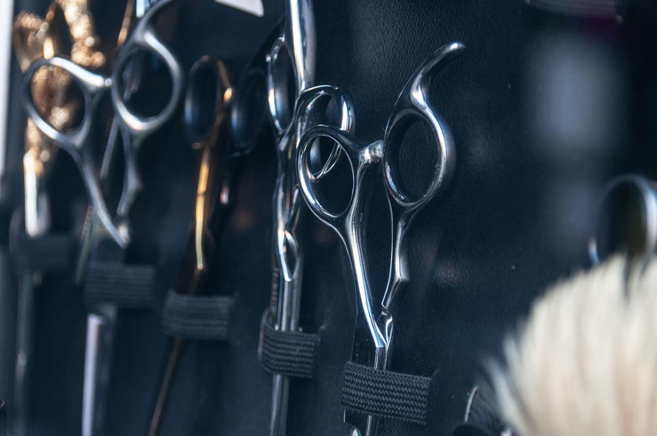 Hairdressing scissors hanging in a row